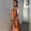 Woman wearing a colorful dress with a blurred background