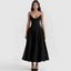 Woman wearing a black strapless dress on a white background